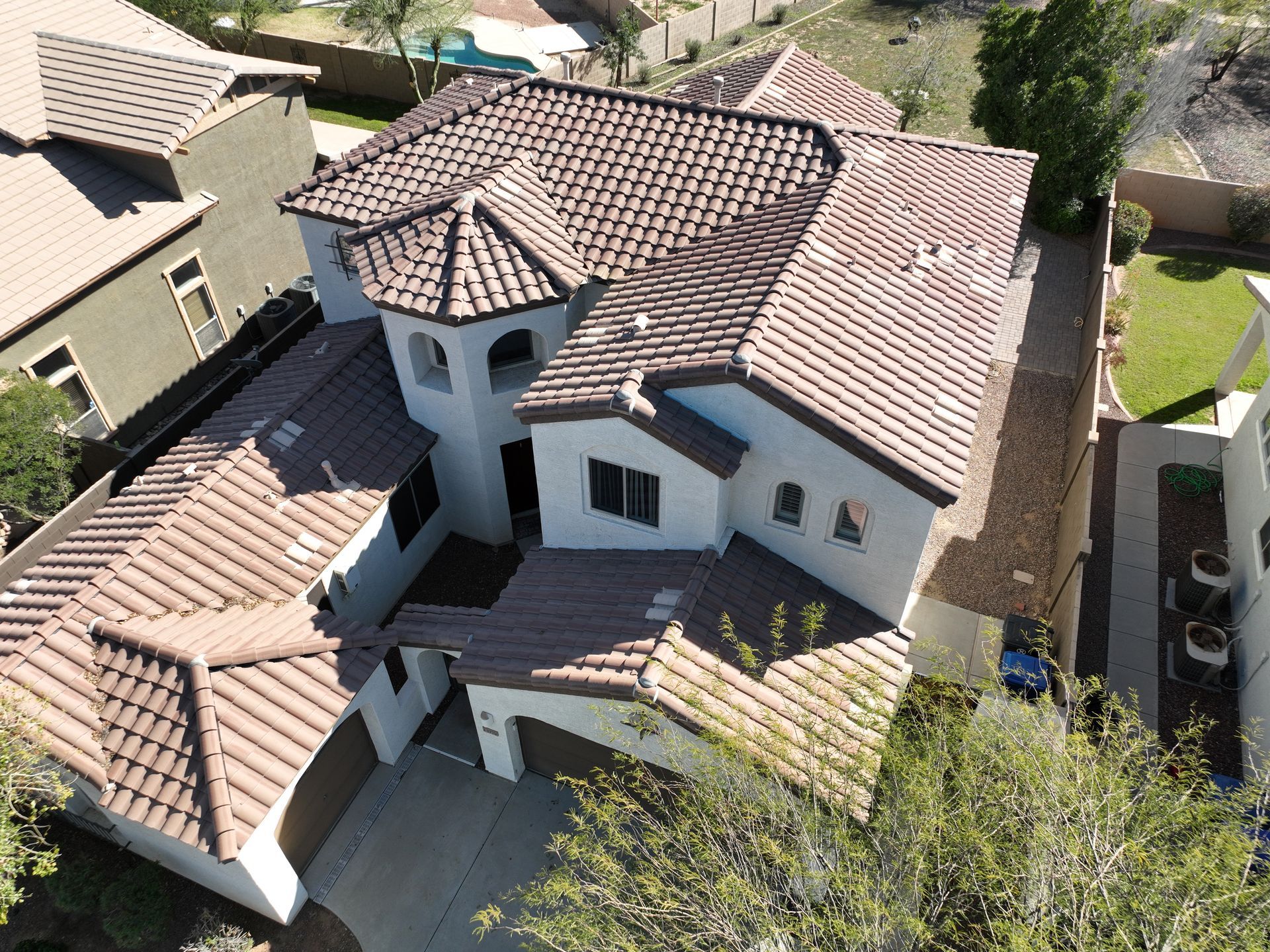 An aerial view of a large house with a tiled roof.