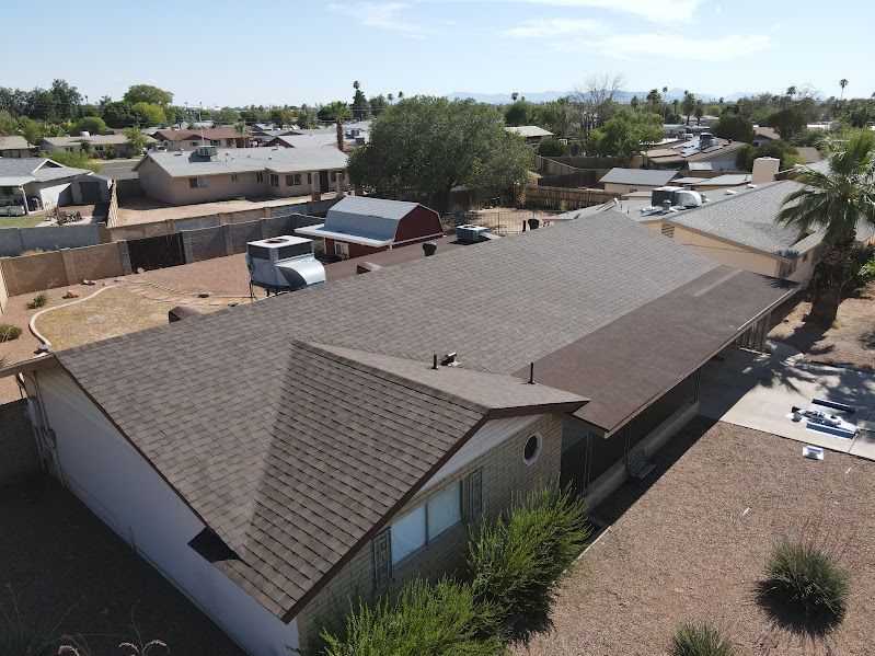 An aerial view of a house with a new roof.