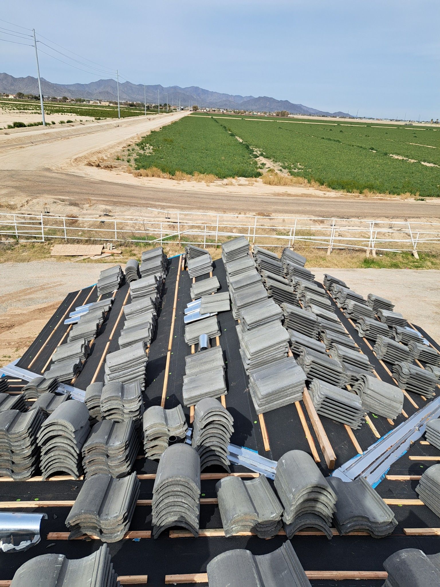 Concrete tiles roofing is stacked on top of each other.