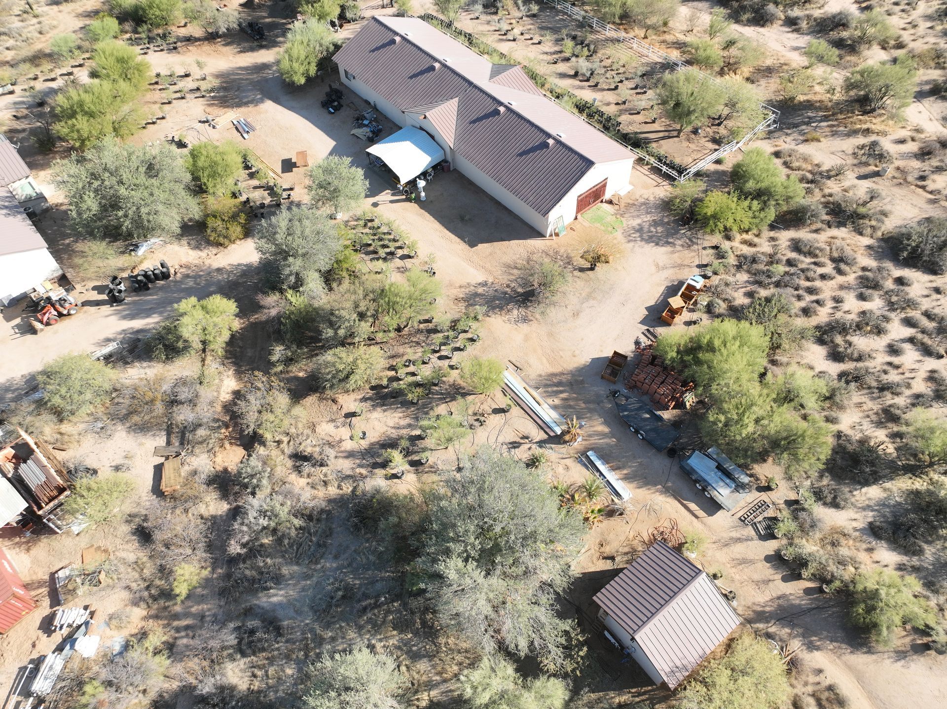 An aerial view of a house in the middle of a desert.