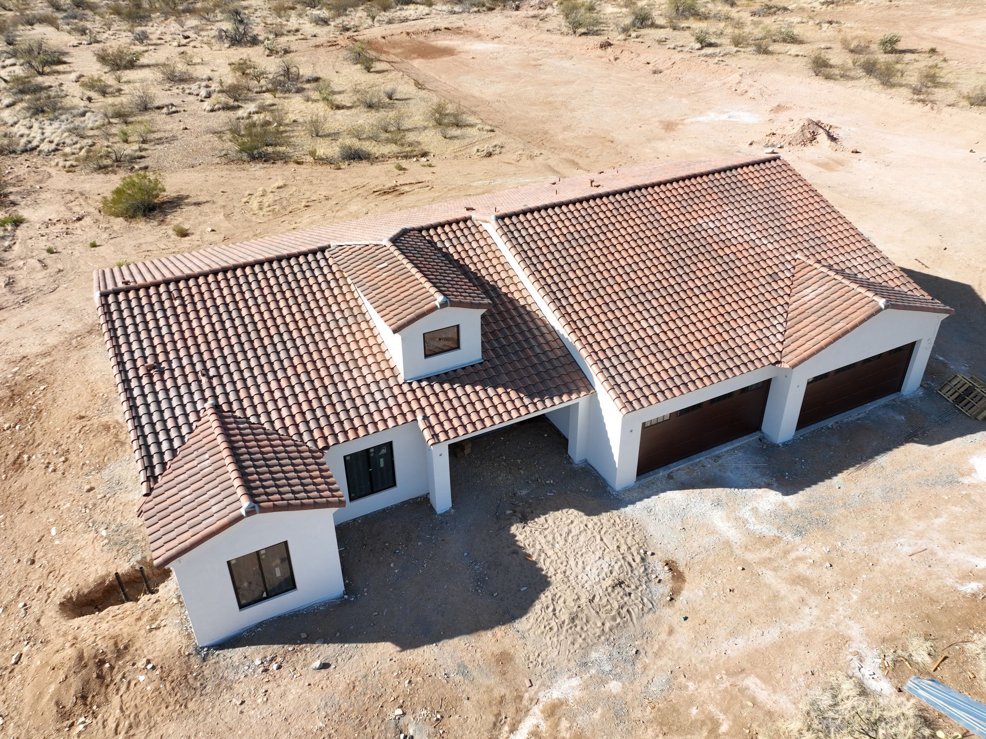 An aerial view of a house with a tiled roof.