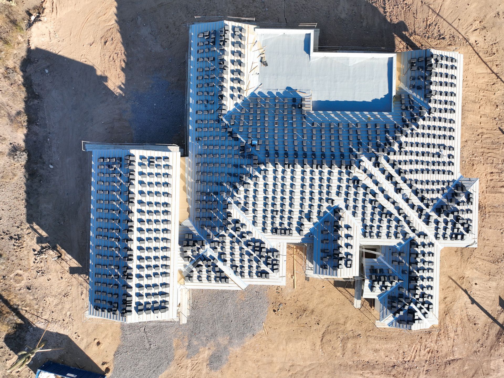An aerial view of a building under construction in the desert.