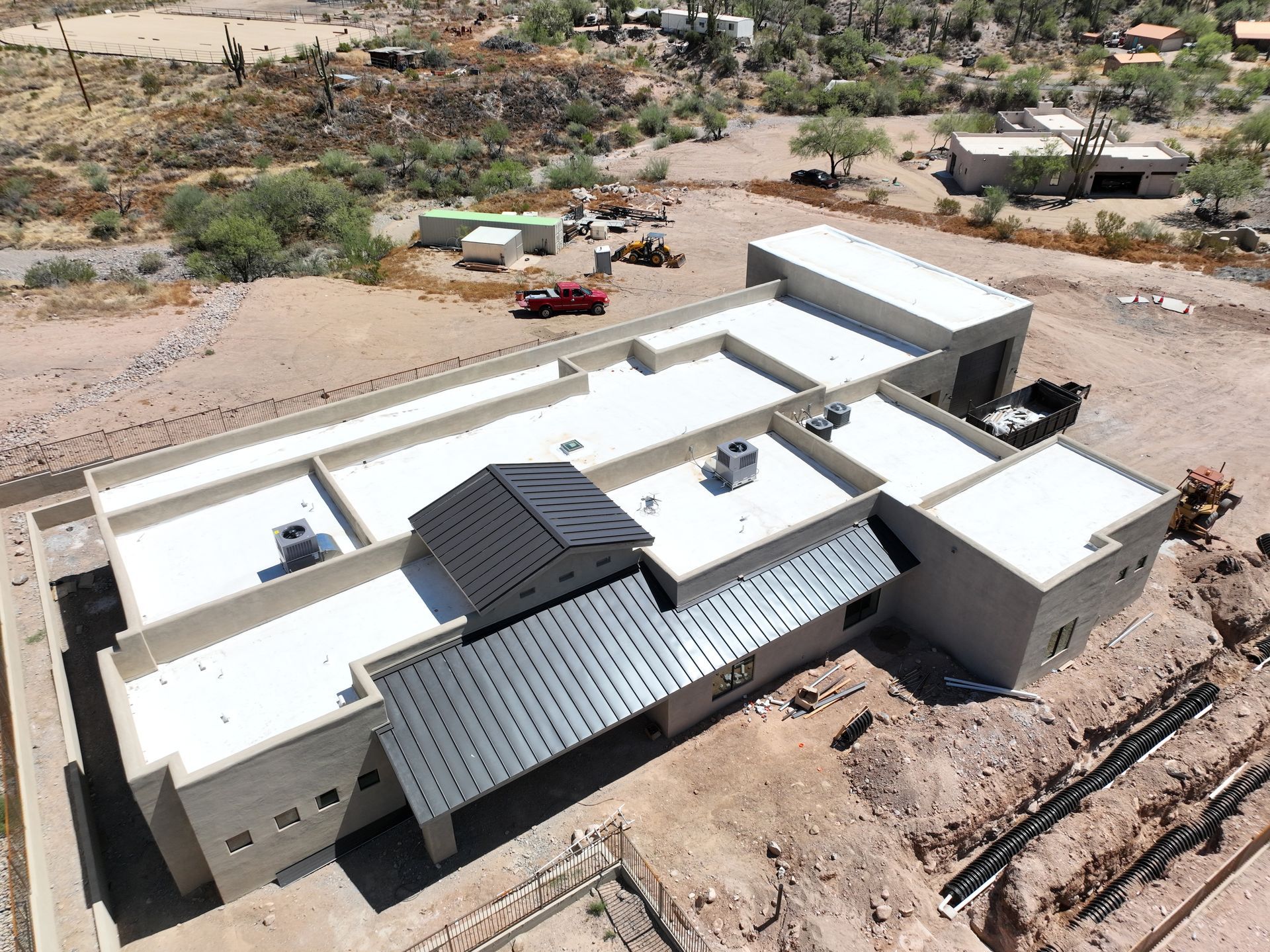 An aerial view of a building under construction in the desert.