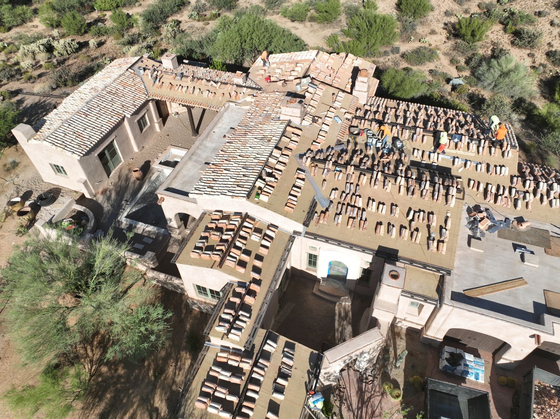 An aerial view of a building under construction in the desert.