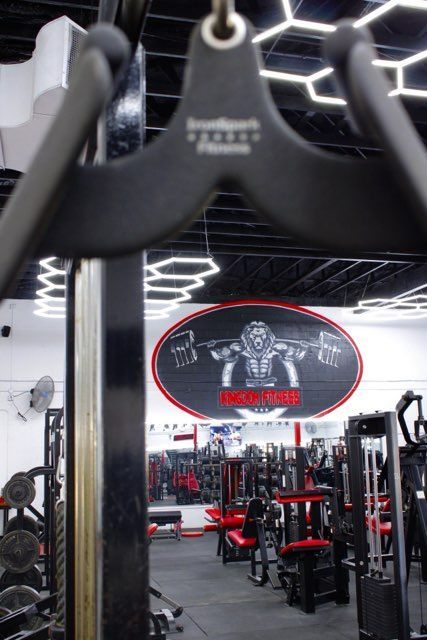 A gym with a monkey painting on the wall