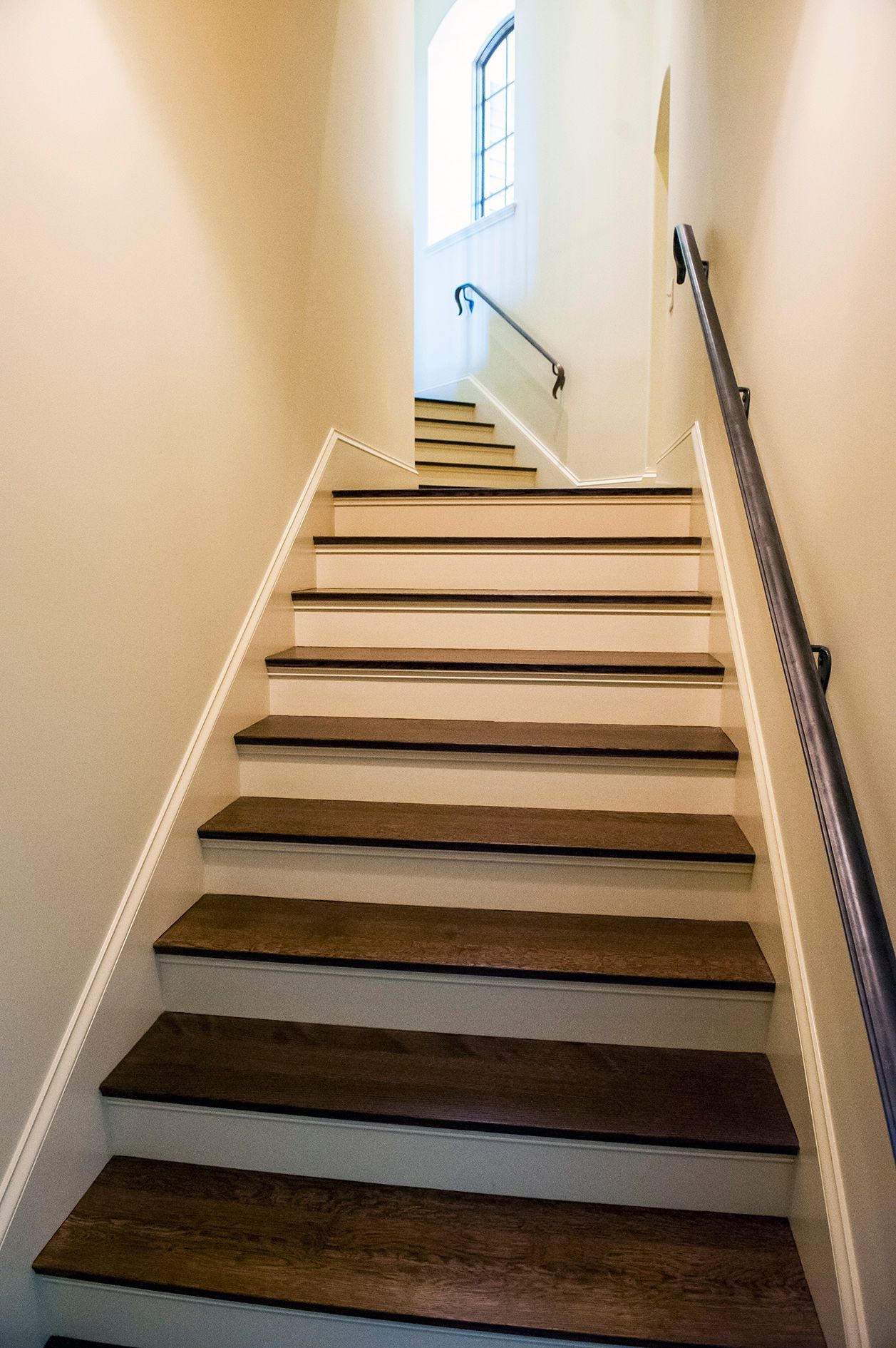 a set of stairs leading up to a window in a building