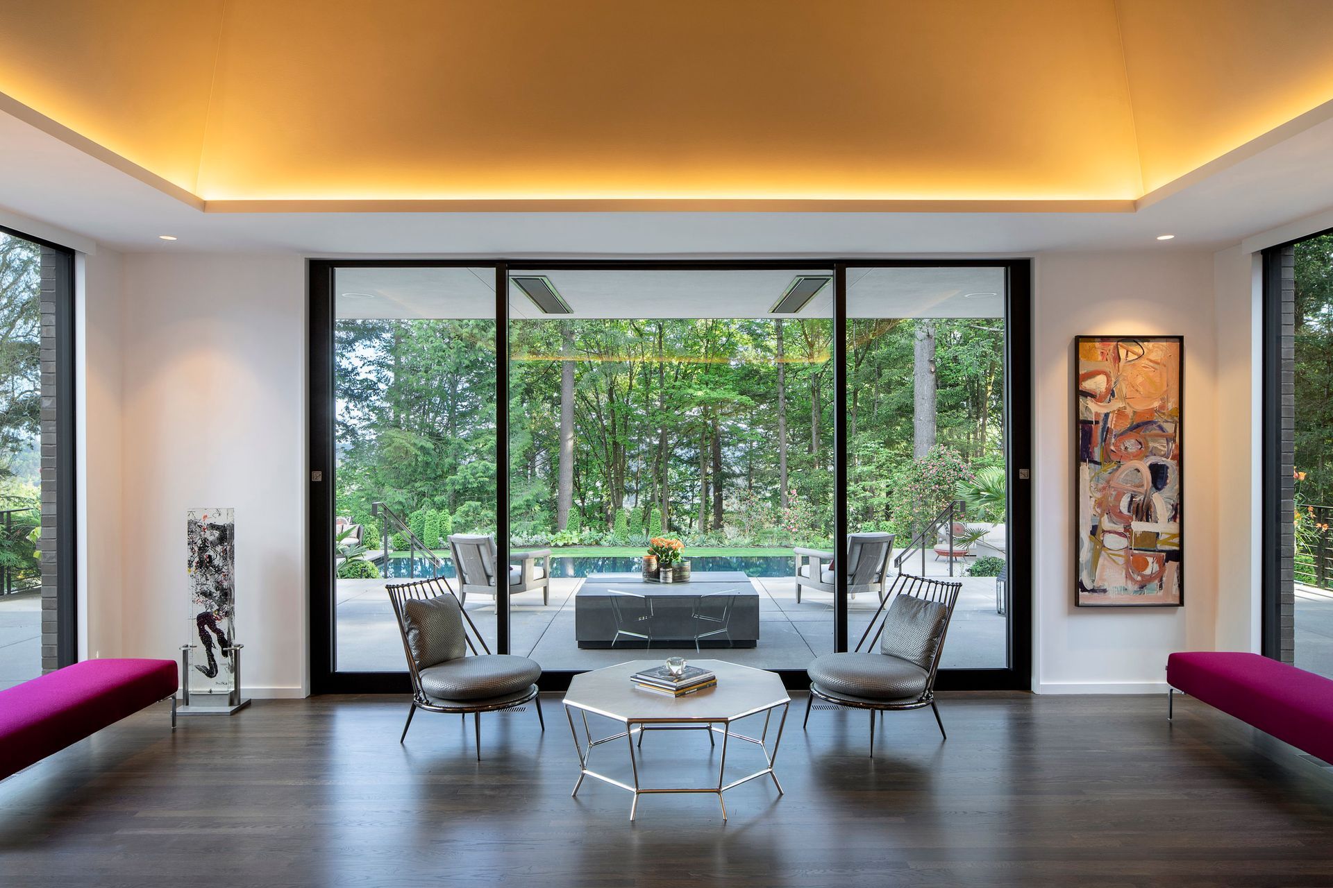 a living room with a table and chairs and a sliding glass door