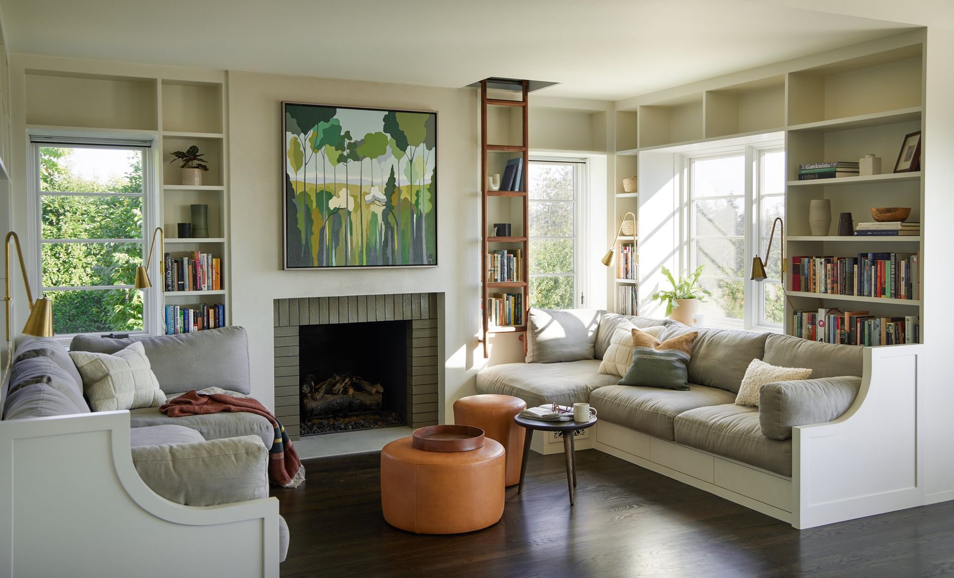 a living room filled with furniture and a fireplace