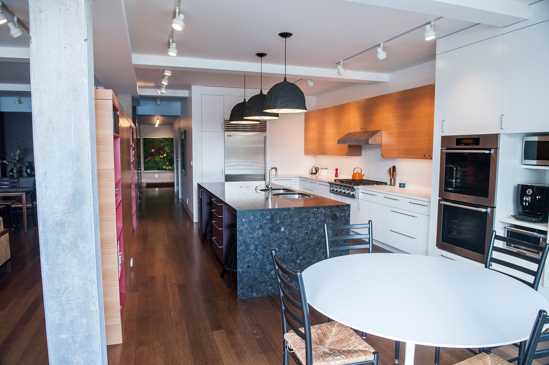 a kitchen with a table and chairs in it