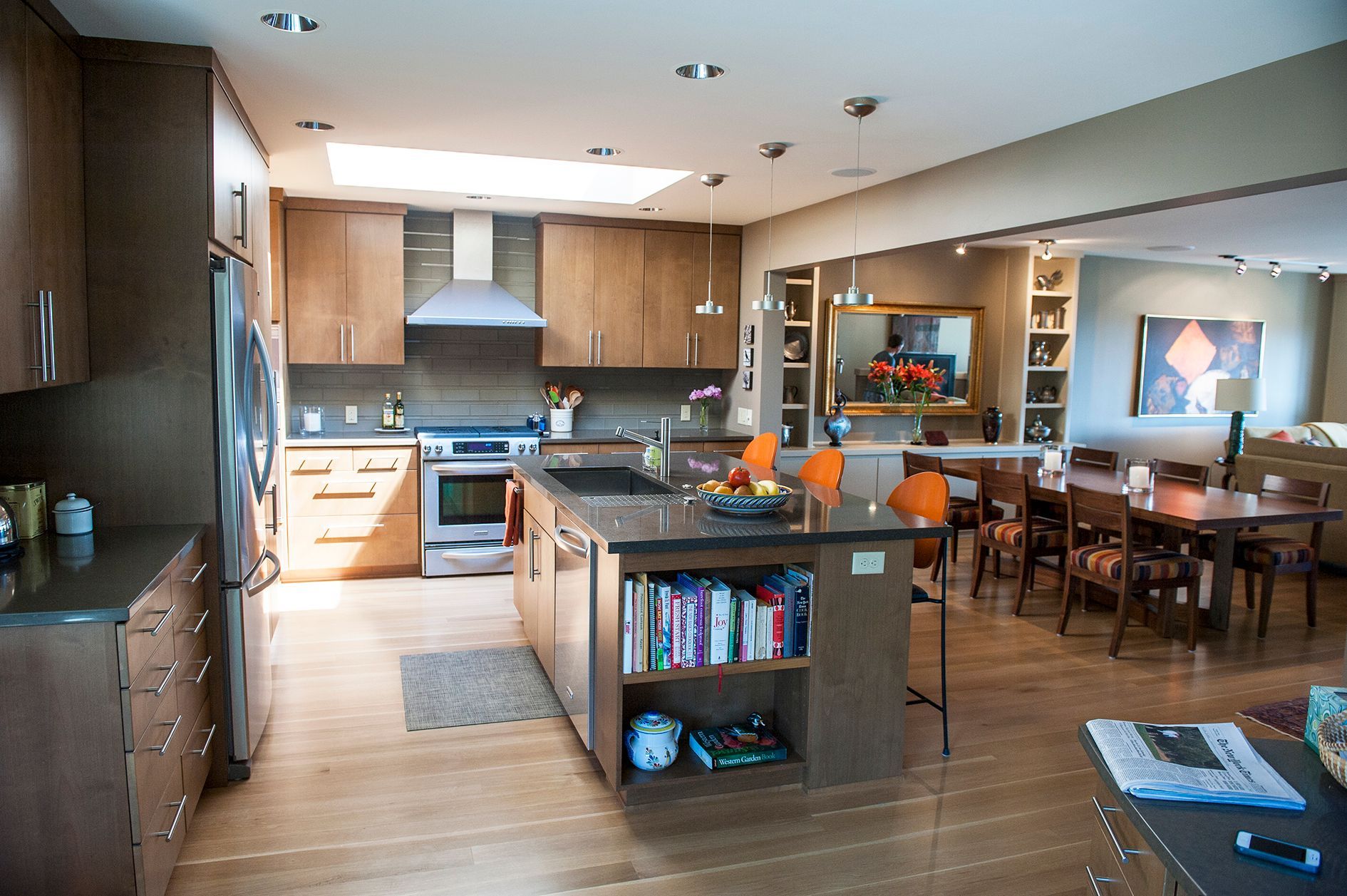 a kitchen with stainless steel appliances and wooden cabinets