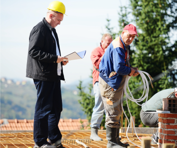 workman listening to engineer's instructions