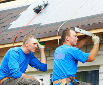 two contractors installing roof