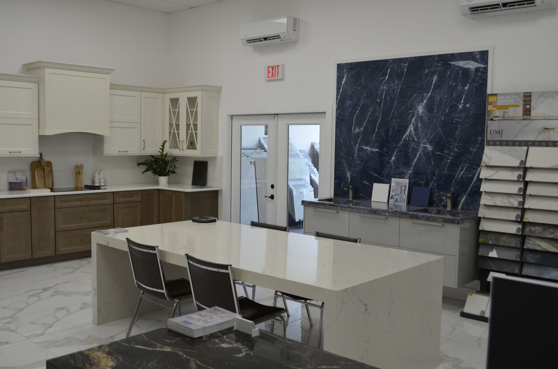 Kitchen showroom with cabinets, countertops, and large marble display.
