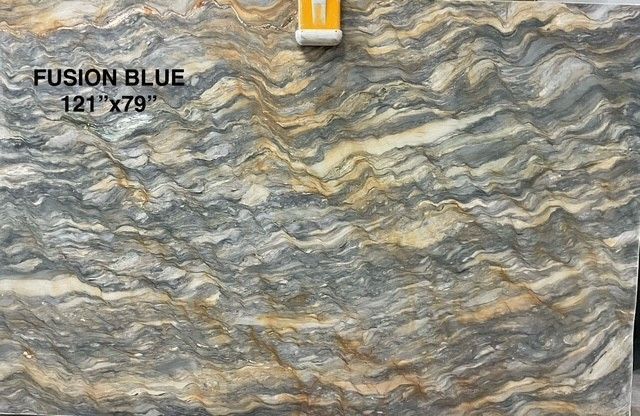 Fusion Blue granite slab, wavy pattern, blue-gray, gold and white streaks