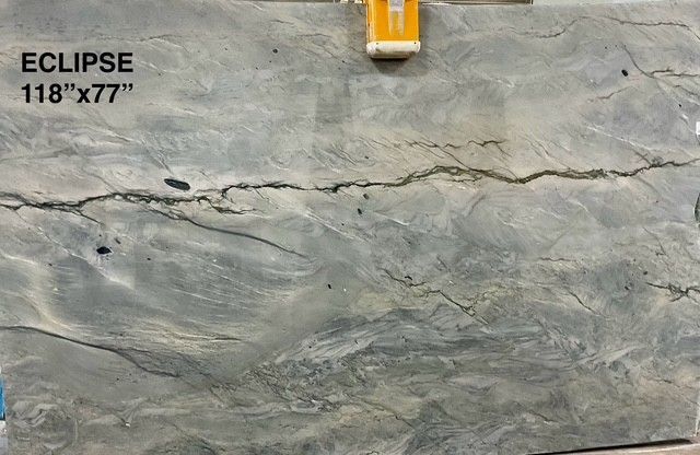 Eclipse stone slab, gray-blue with swirling patterns and a prominent crack