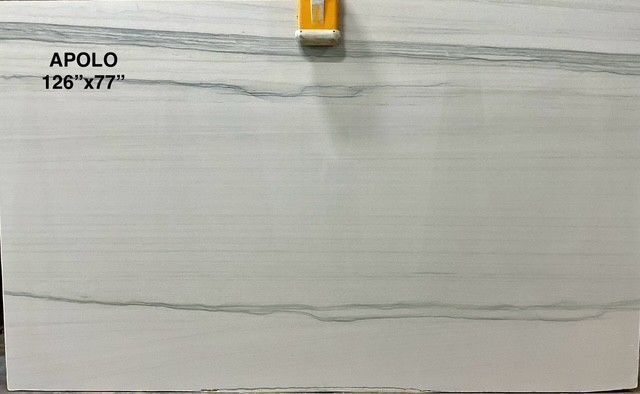 A large slab of white marble with gray veining