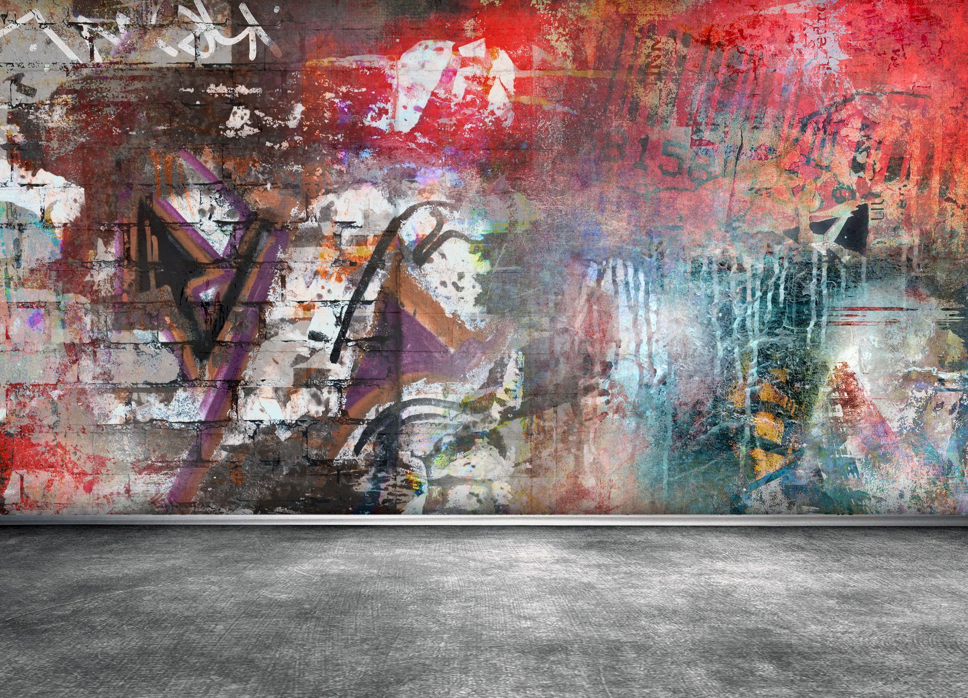 Graffiti-covered brick wall with a concrete floor. Vibrant colors and textures dominate the space.