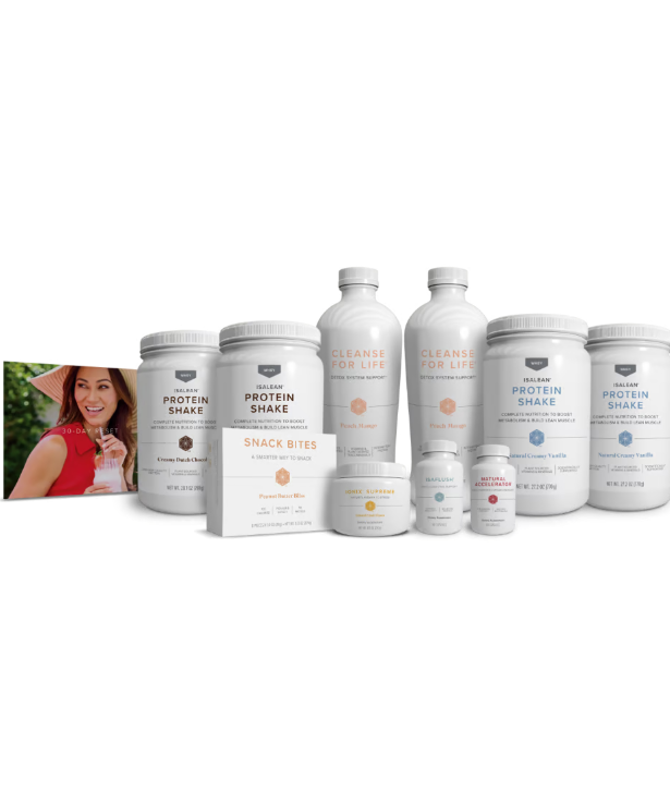 A woman is standing in front of a bunch of bottles and boxes