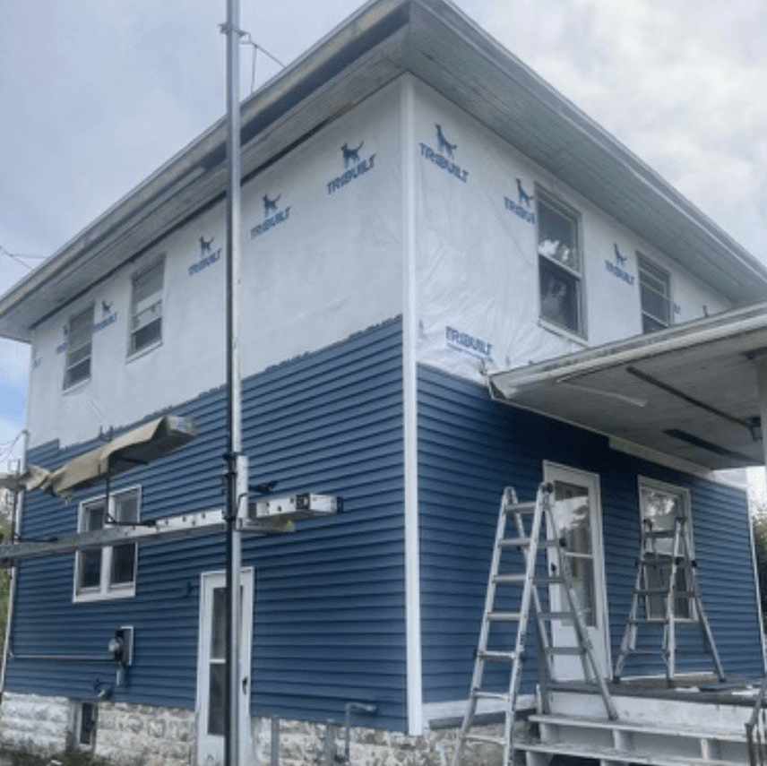 House with blue siding in progress