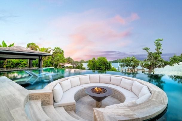 There is a fire pit in the middle of the pool.