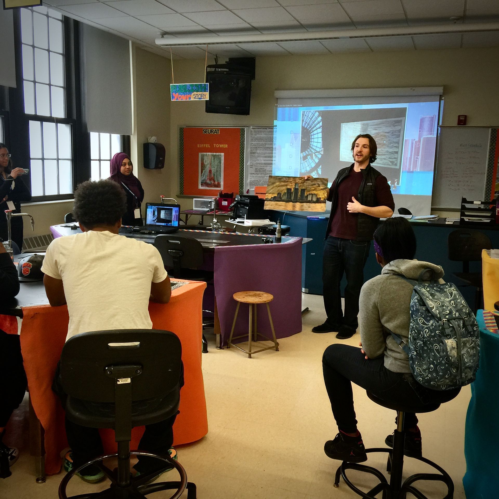 A man is giving a presentation to a group of people