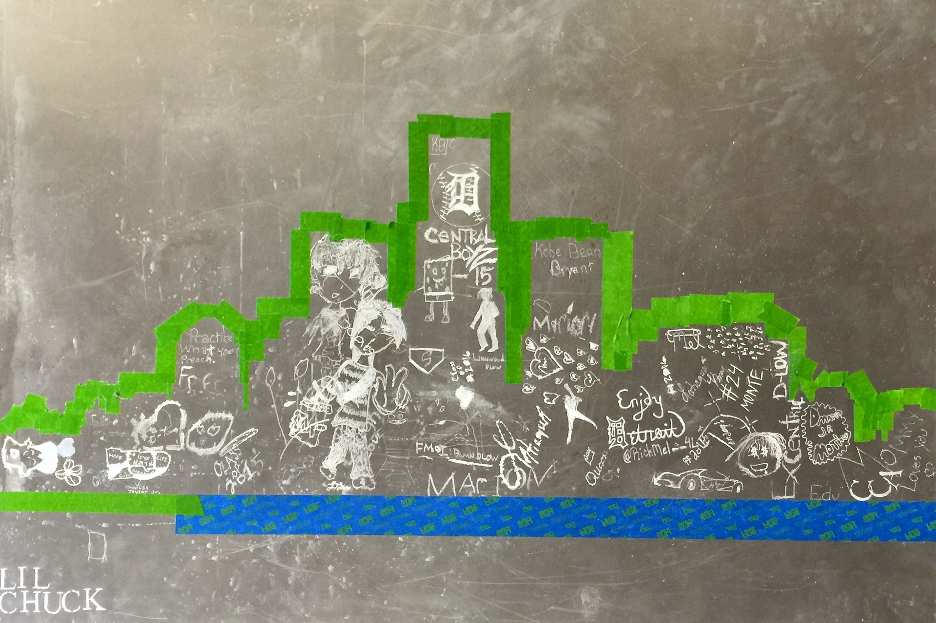 A chalkboard with a green border and the word hook on it