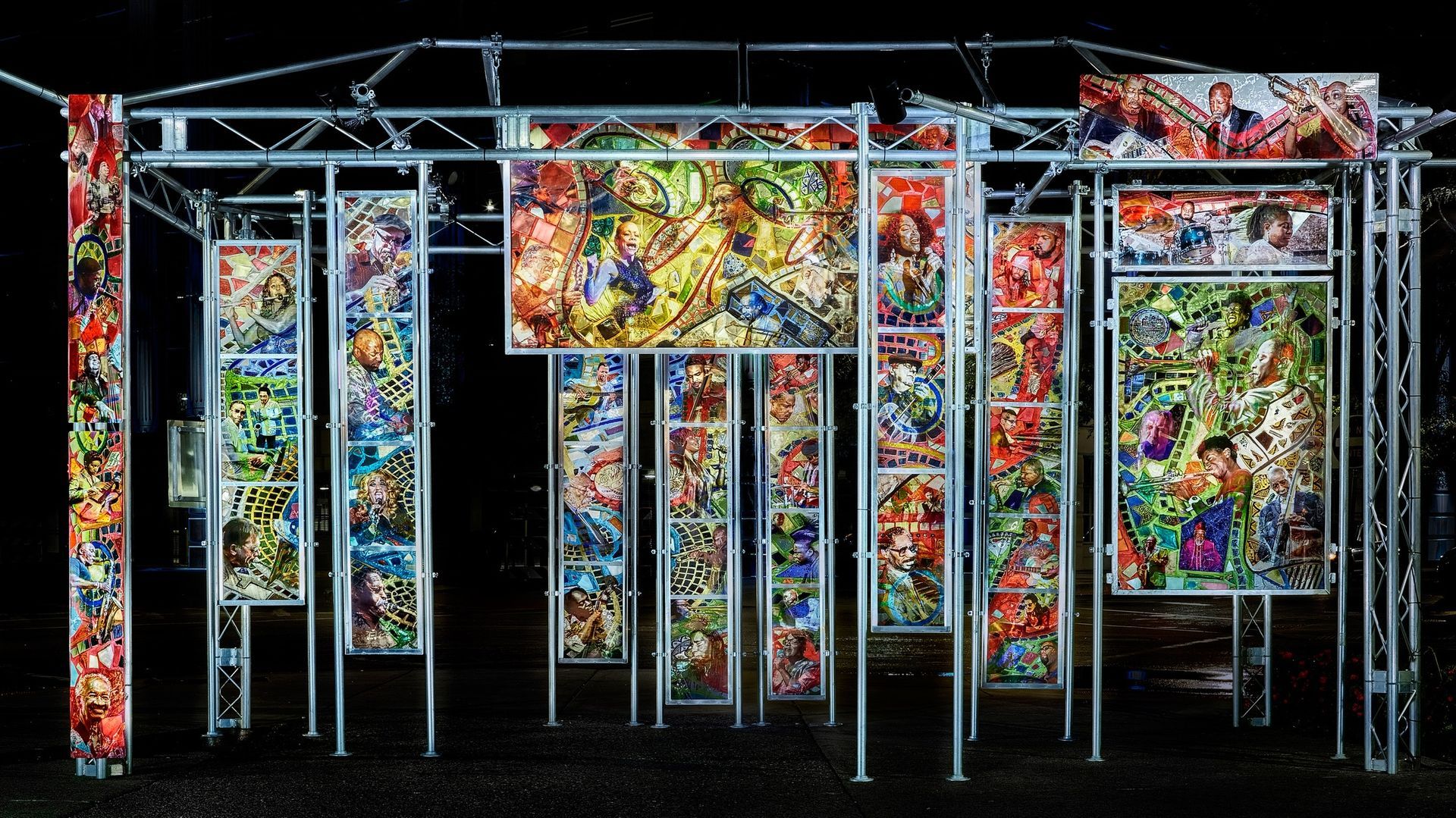 A colorful painting is hanging on a metal structure