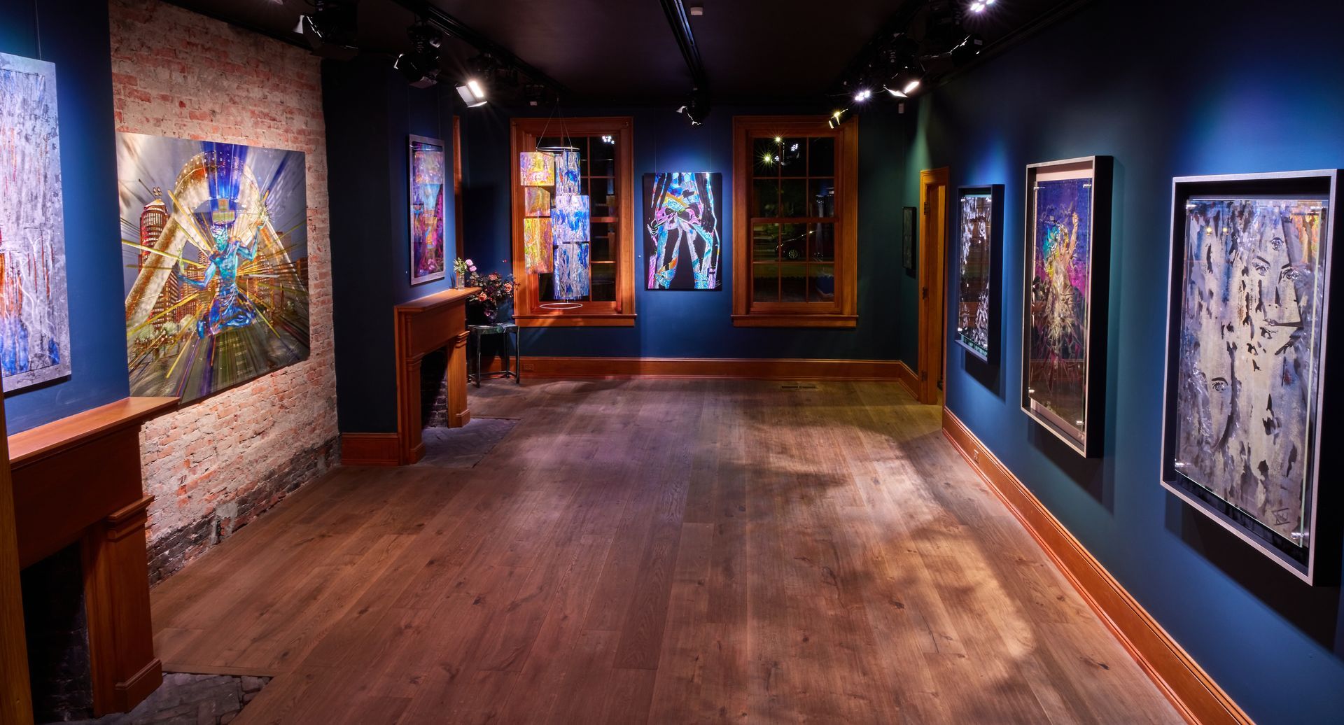 A large room with a lot of paintings on the walls