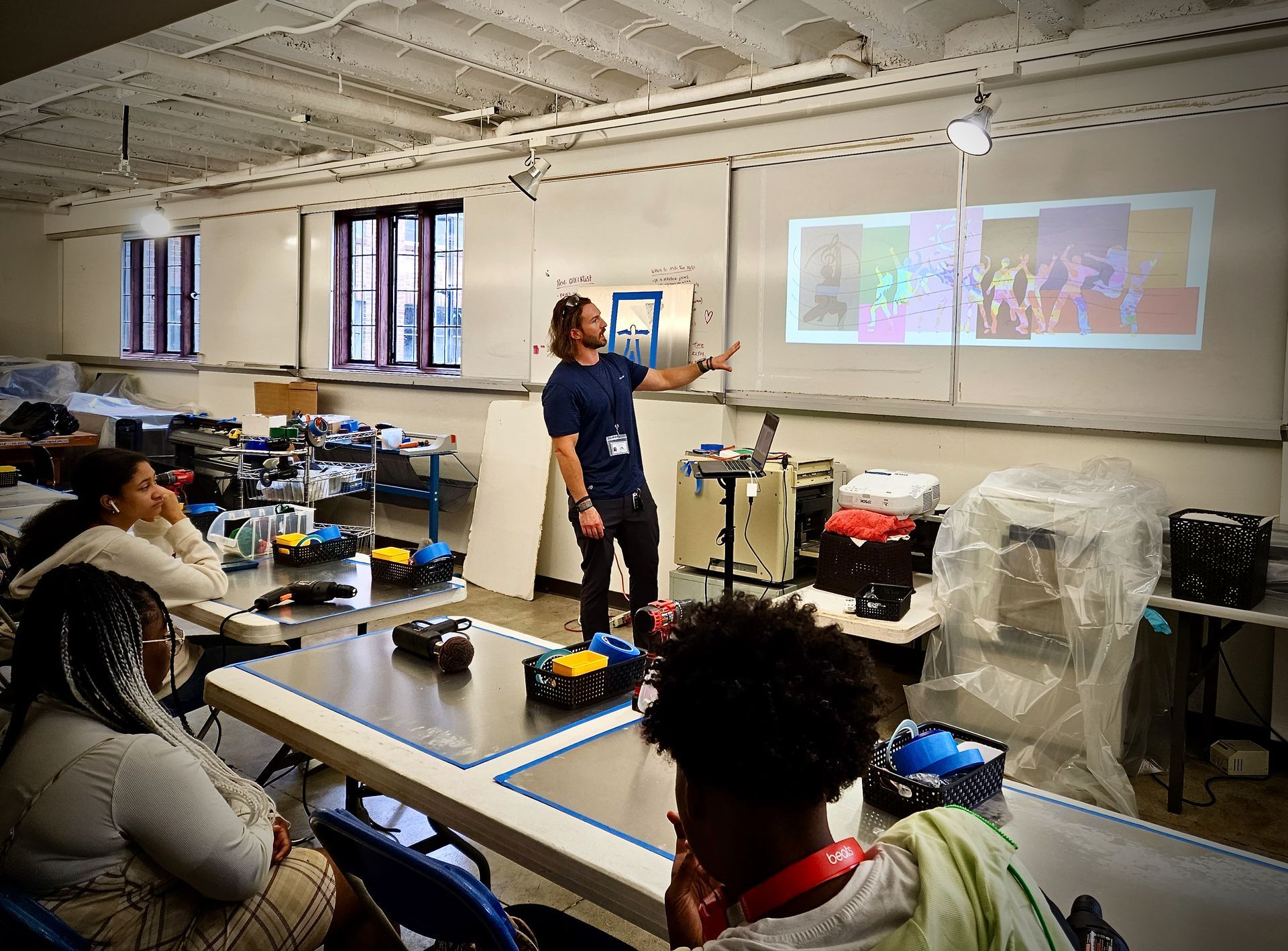 A man is giving a presentation to a group of people