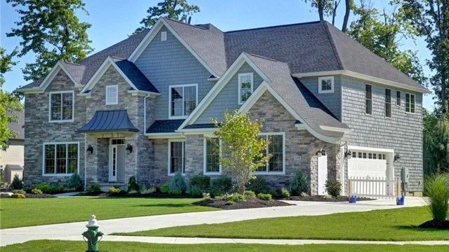 A large house with a fire hydrant in front of it