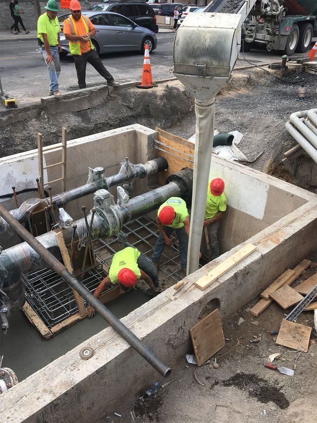 a group of construction workers are working on a construction site .