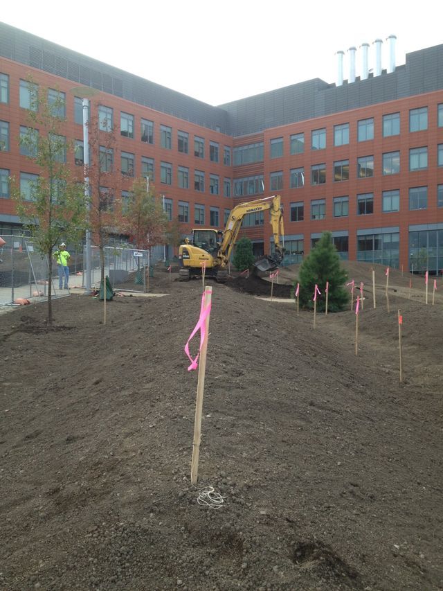 a group of construction workers are working on a construction site .