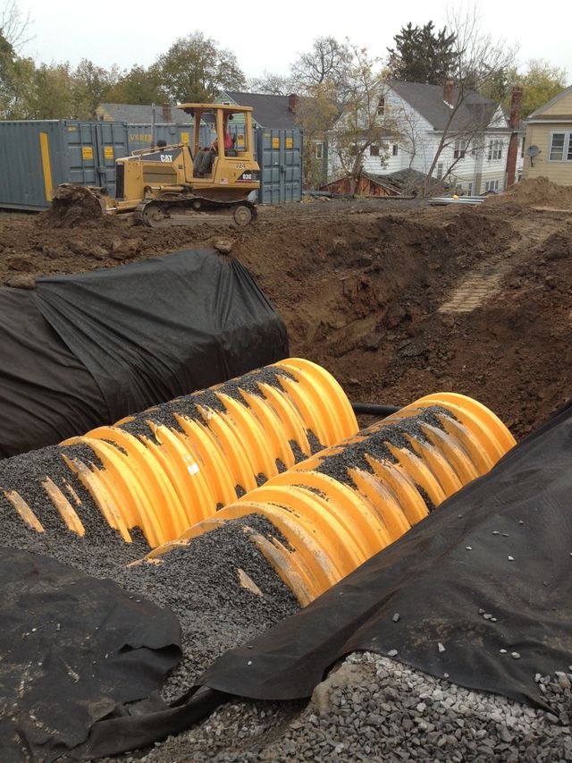 a construction site with a bulldozer in the background