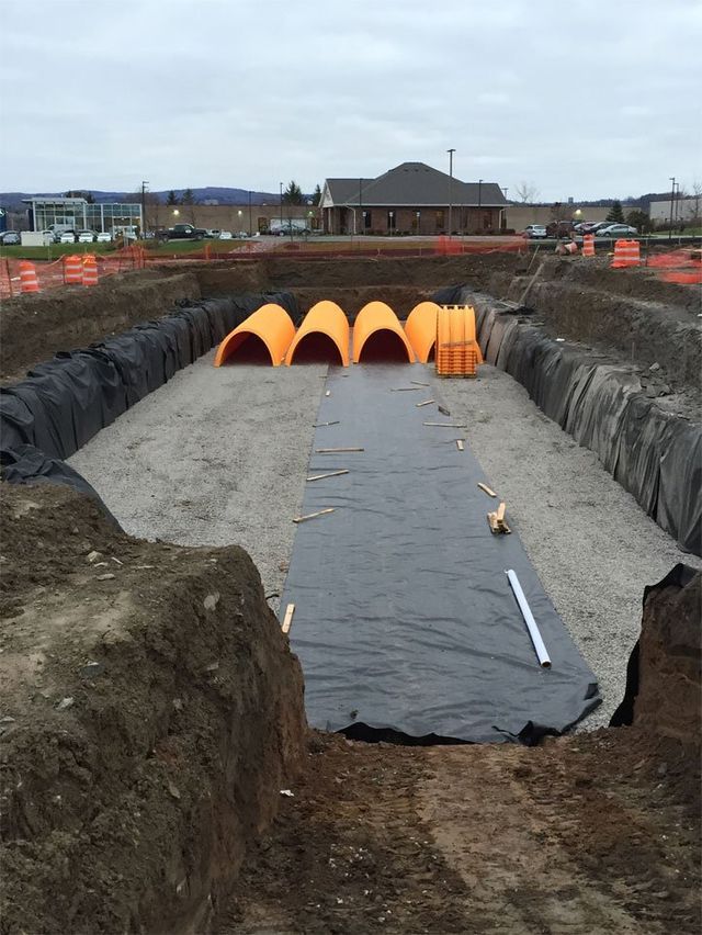 a construction site with a lot of pipes in it