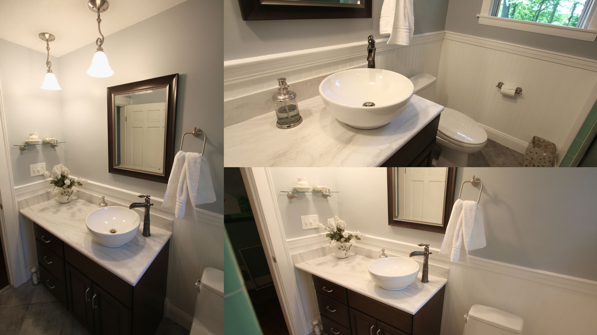 Bathroom vanity with white sink, mirror, and wall sconces in a modern beige-tiled room