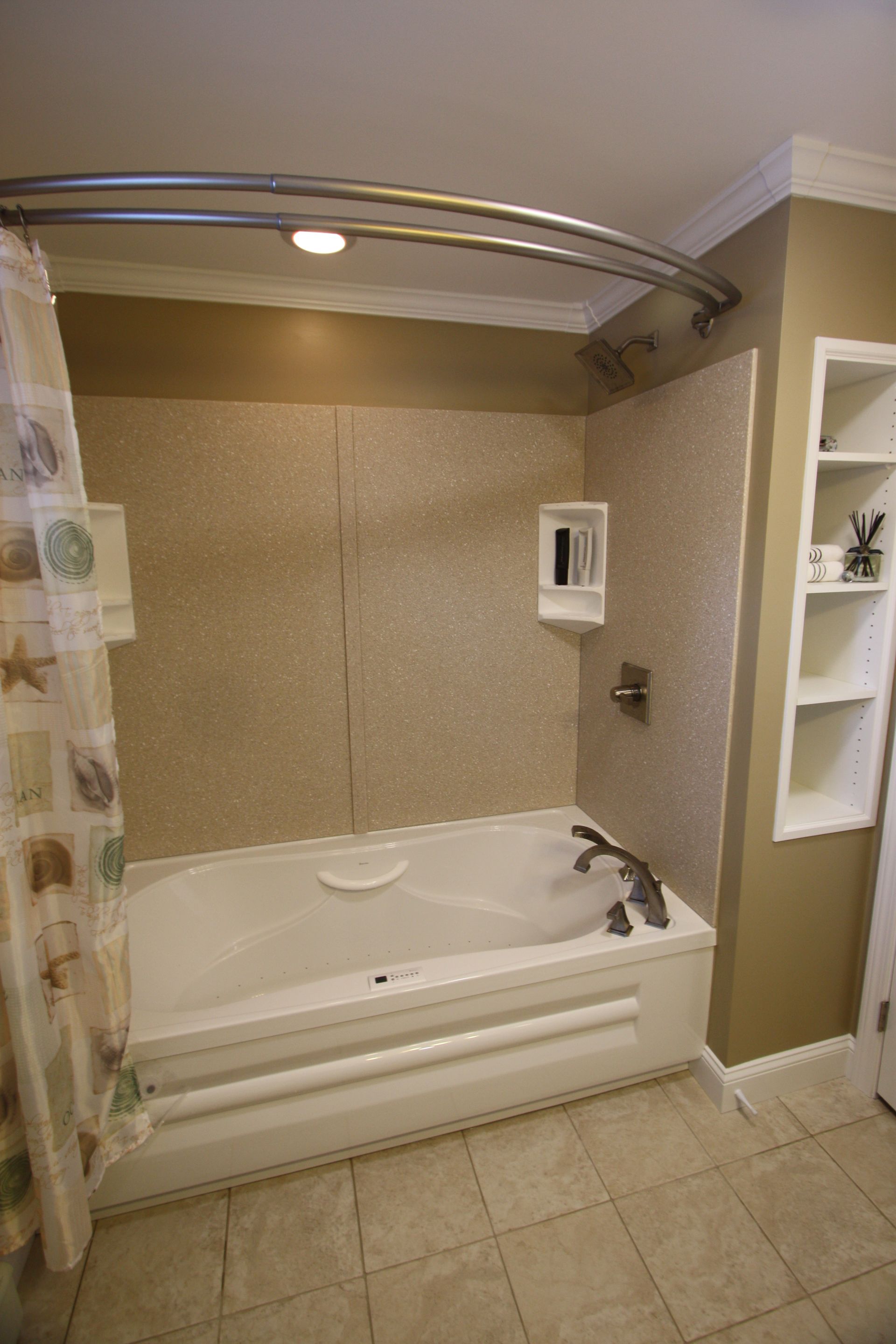There is a bathtub in the bathroom with a shower curtain.