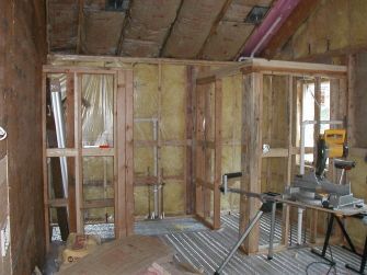 A room that is being built with a saw in it.