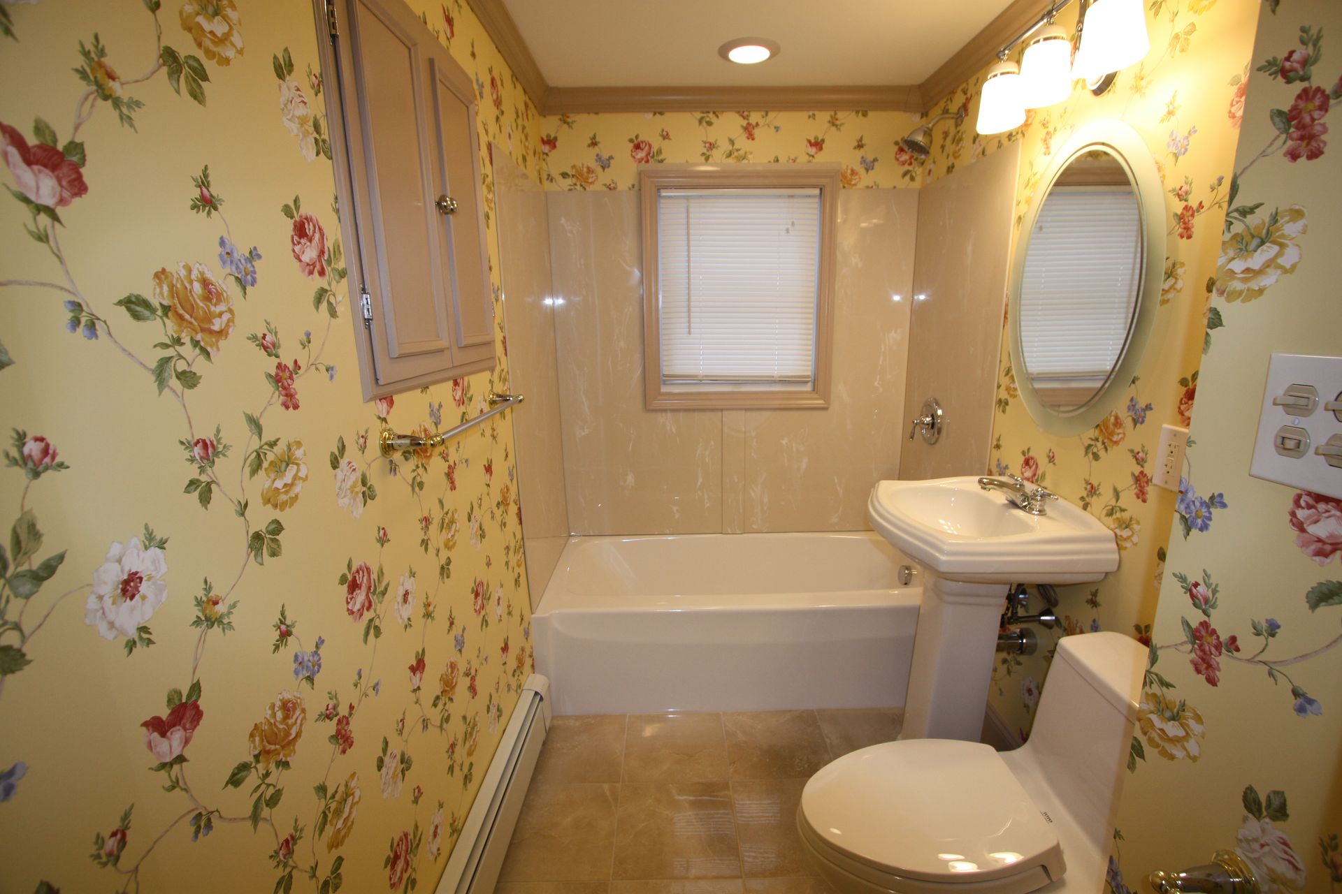 A bathroom with a toilet, a sink, and a tub.