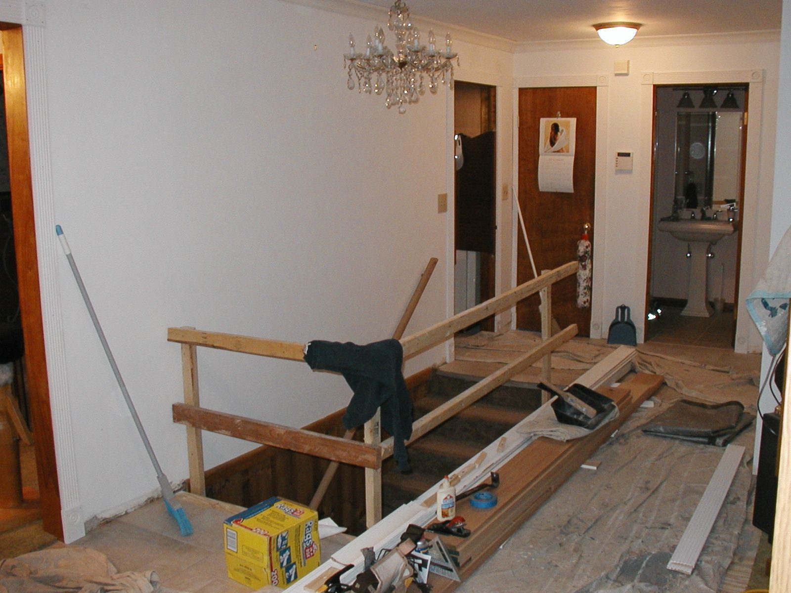 A wooden railing is being built in a room.