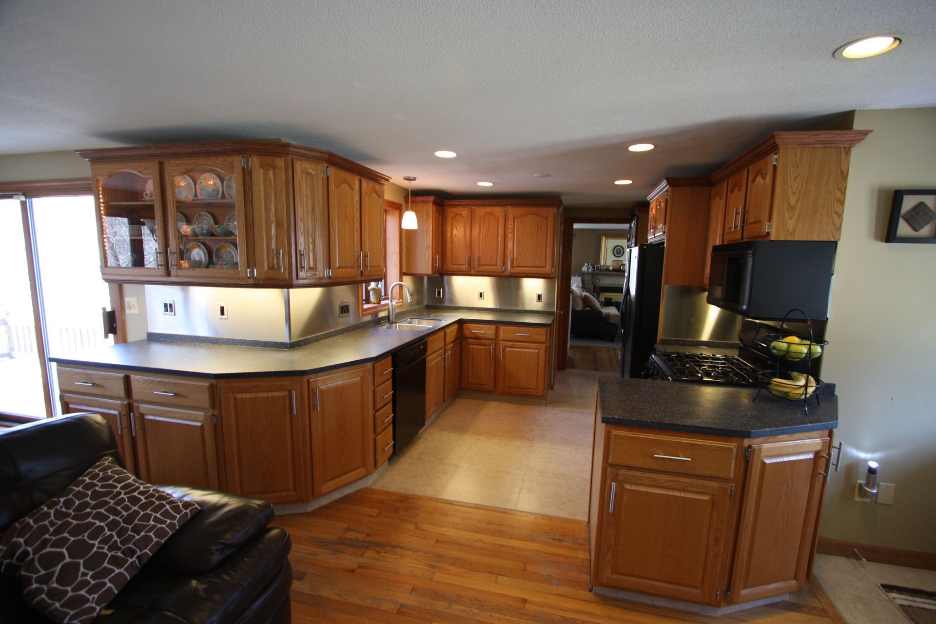 A kitchen with wooden cabinets and stainless steel appliances.