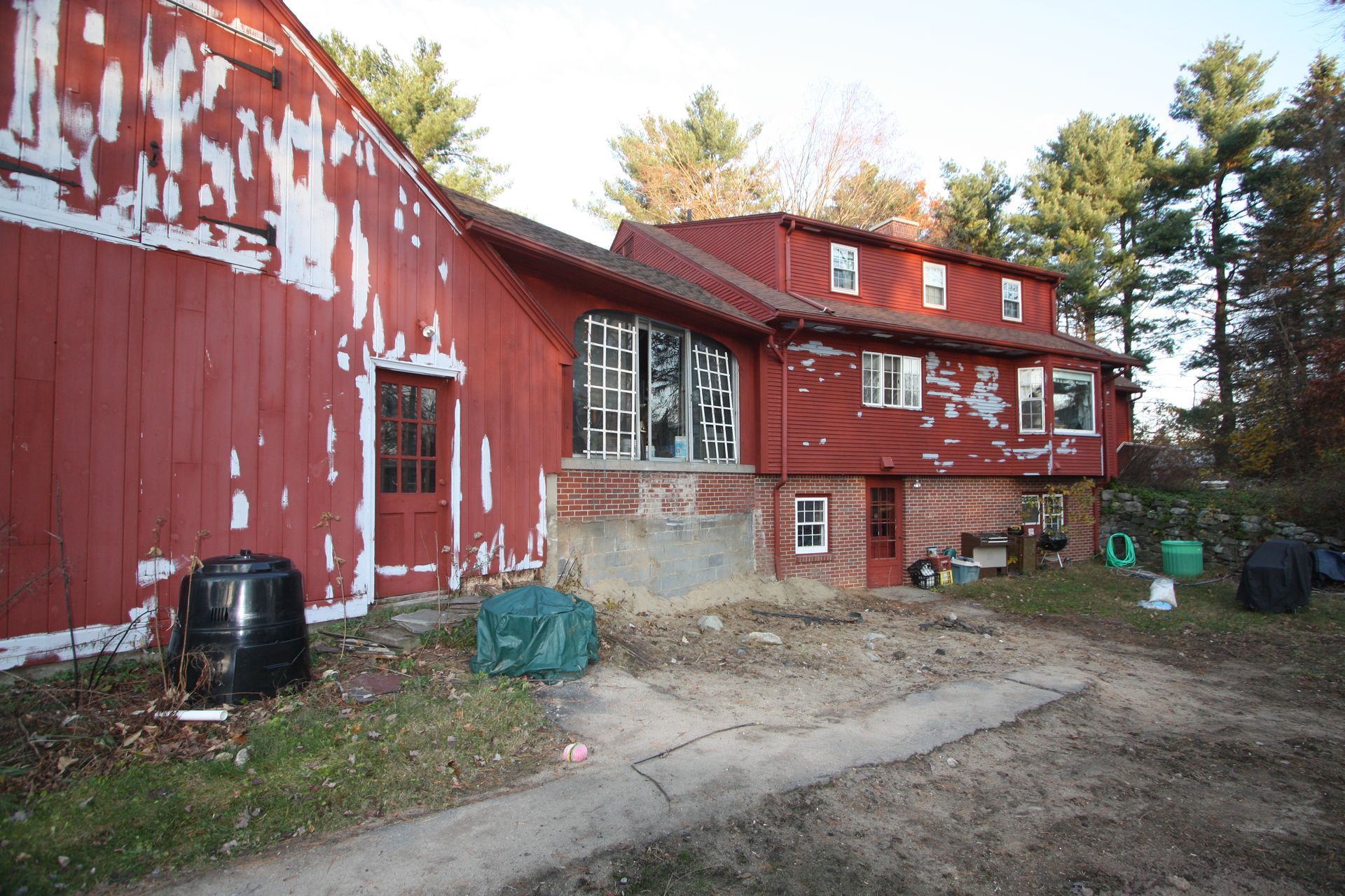 A large red barn with the word link painted on it.