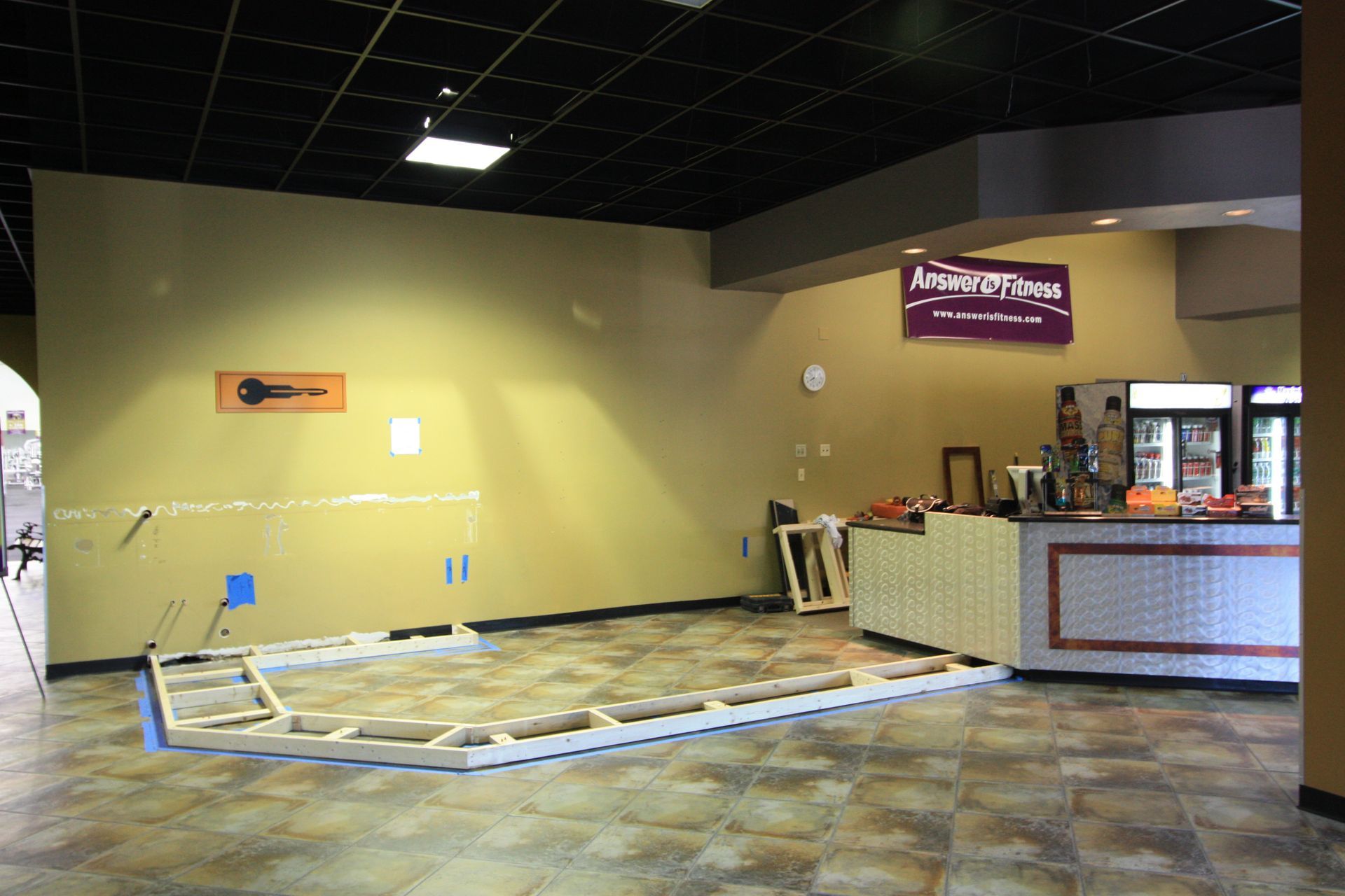 An empty room with a sign on the wall that says 'aurora drive'.