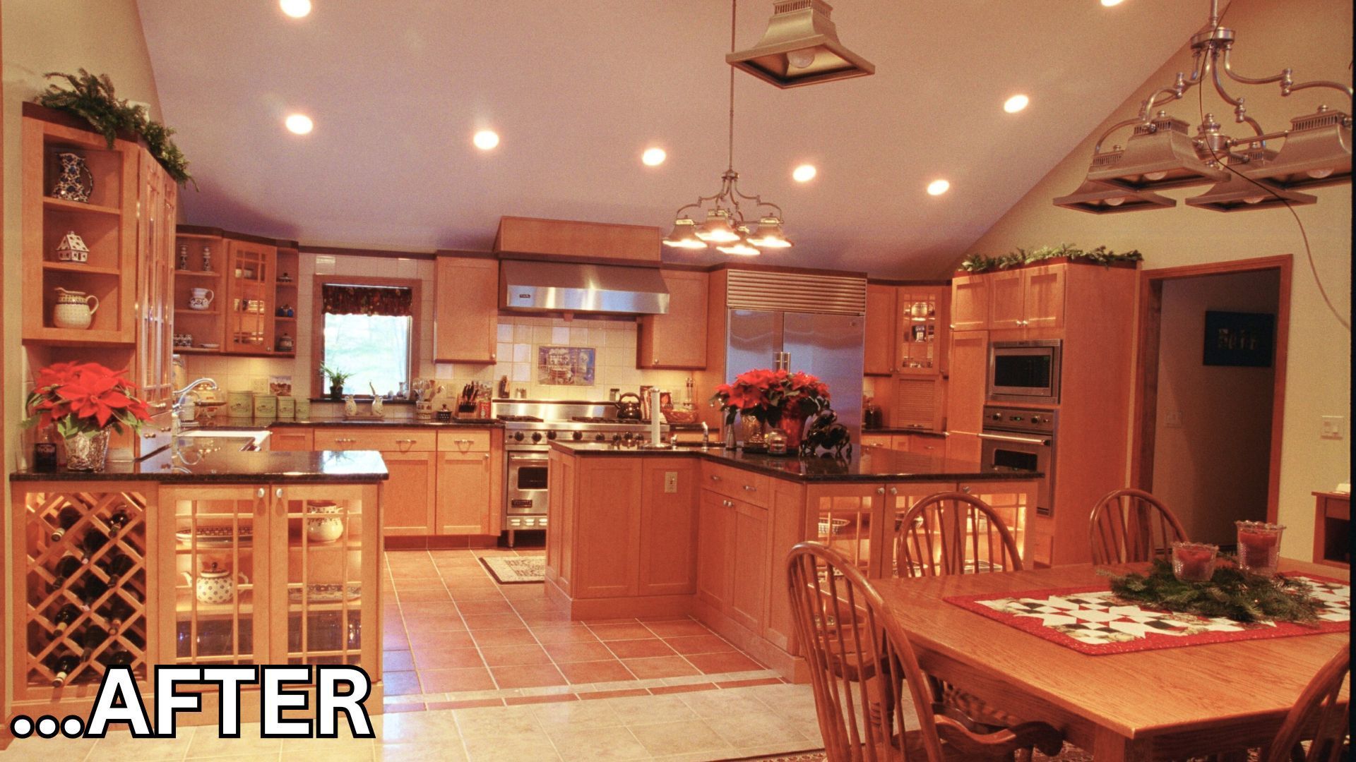 Warm, spacious kitchen and dining area with wood cabinets, tiled floor, and hanging pendant lights.