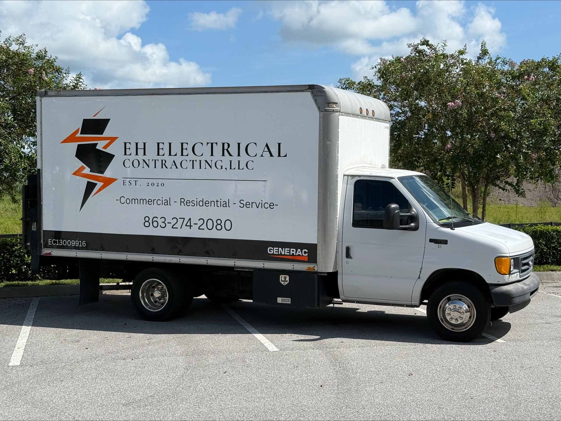 White EH Electrical Contracting van parked outside; business logo visible.