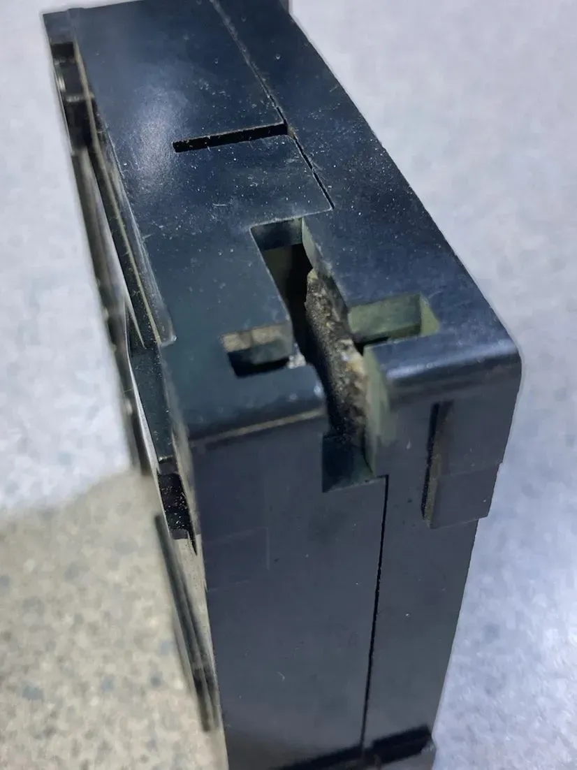 Breaker showing signs of arcing and fatigue.