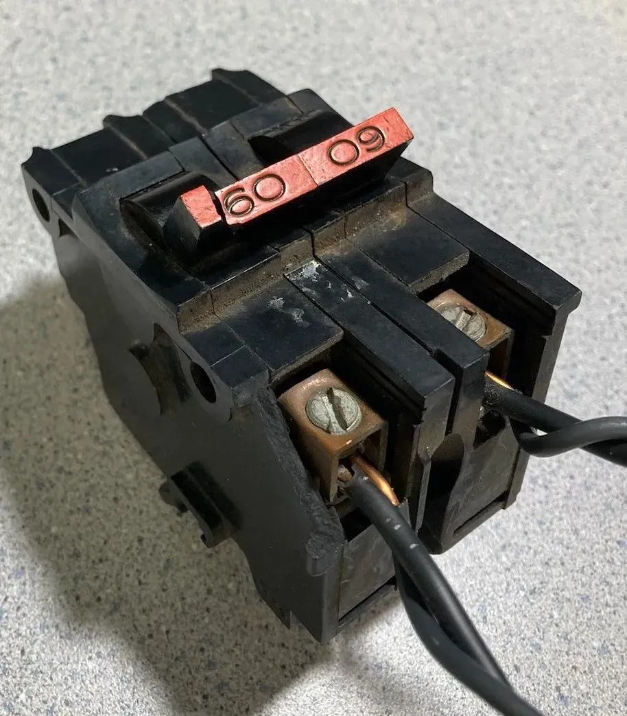 60amp breaker with double-taps (2 wires into the same terminal), wrong gauge wire and broken handle.