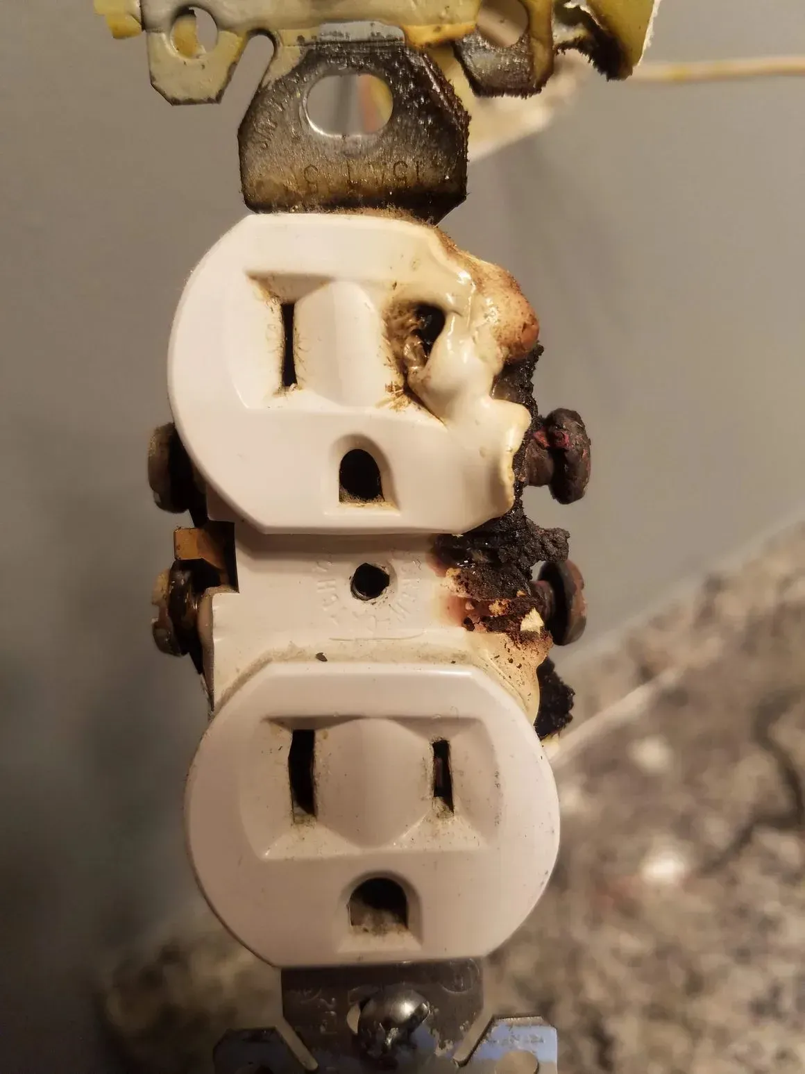 Melted duplex outlet. Replace ASAP!