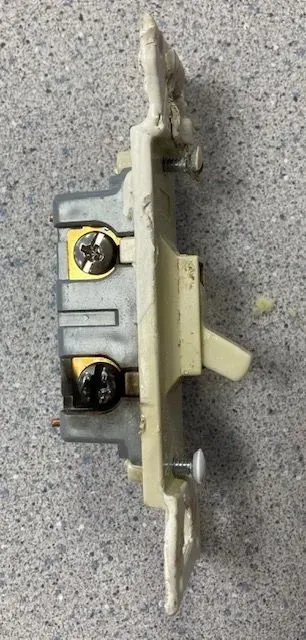 Burnt connection on light switch (blackened screw). This is from a loose connection which created heat over time.