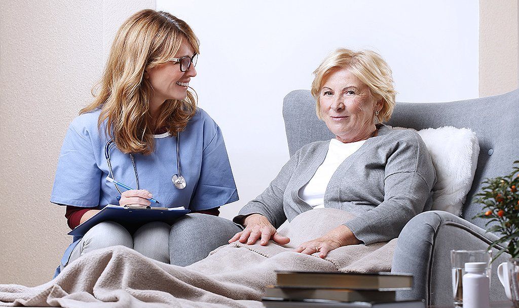 Learn More About In-Home Care Caregiver taking care of the old woman