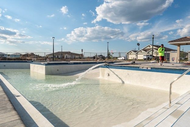 A new swimming pool is being filled with water